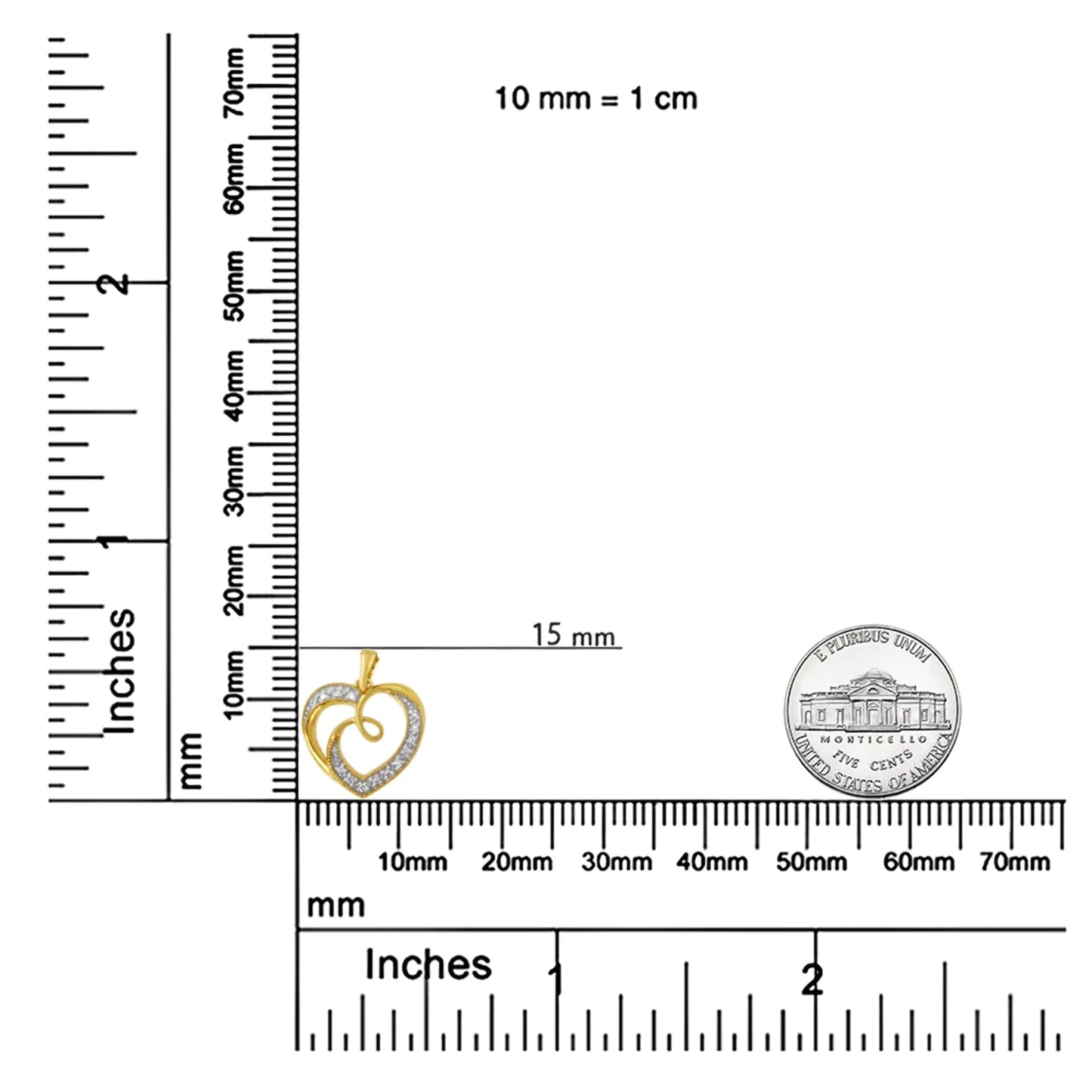 Gold and diamond heart-shaped pendant beside a ruler and US nickel for size reference