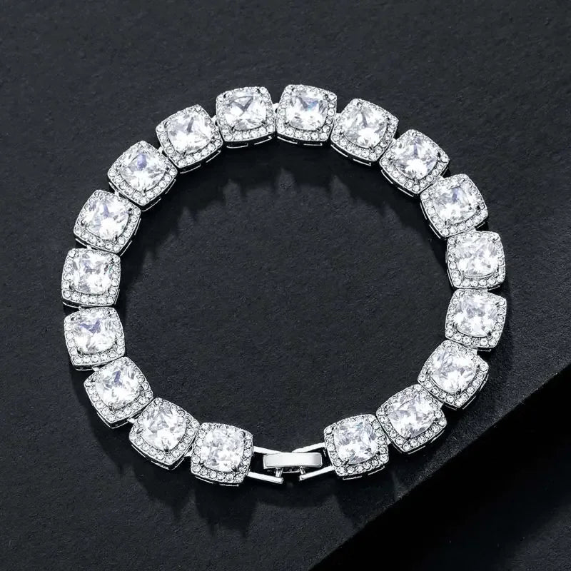 Elegant silver bracelet featuring large square-cut cubic zirconia stones with small sparkling accents on black background