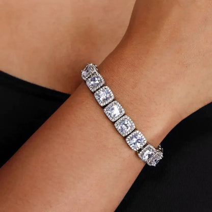 Elegant silver bracelet with large square cubic zirconia stones on a wrist, luxury fine jewellery