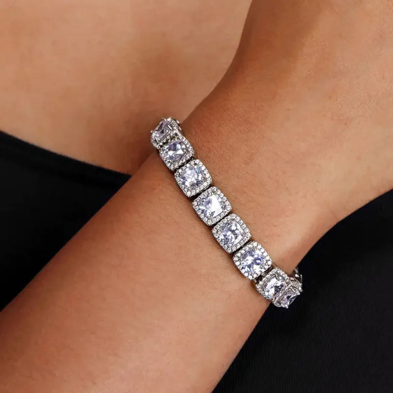 Elegant silver bracelet with square clear gemstones worn on wrist, luxury fine jewelry for women
