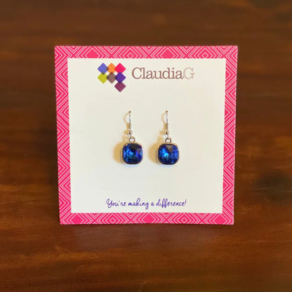ClaudiaG brand blue faceted gemstone dangle earrings on pink patterned display card