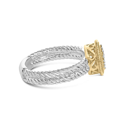 Two-tone rope design ring with a silver twisted band and a gold intricate square setting with small diamonds