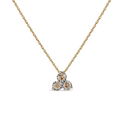 Gold chain necklace with a triple round champagne diamond pendant in white gold setting