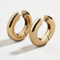 Pair of polished gold hoop earrings with smooth, thick design on white background