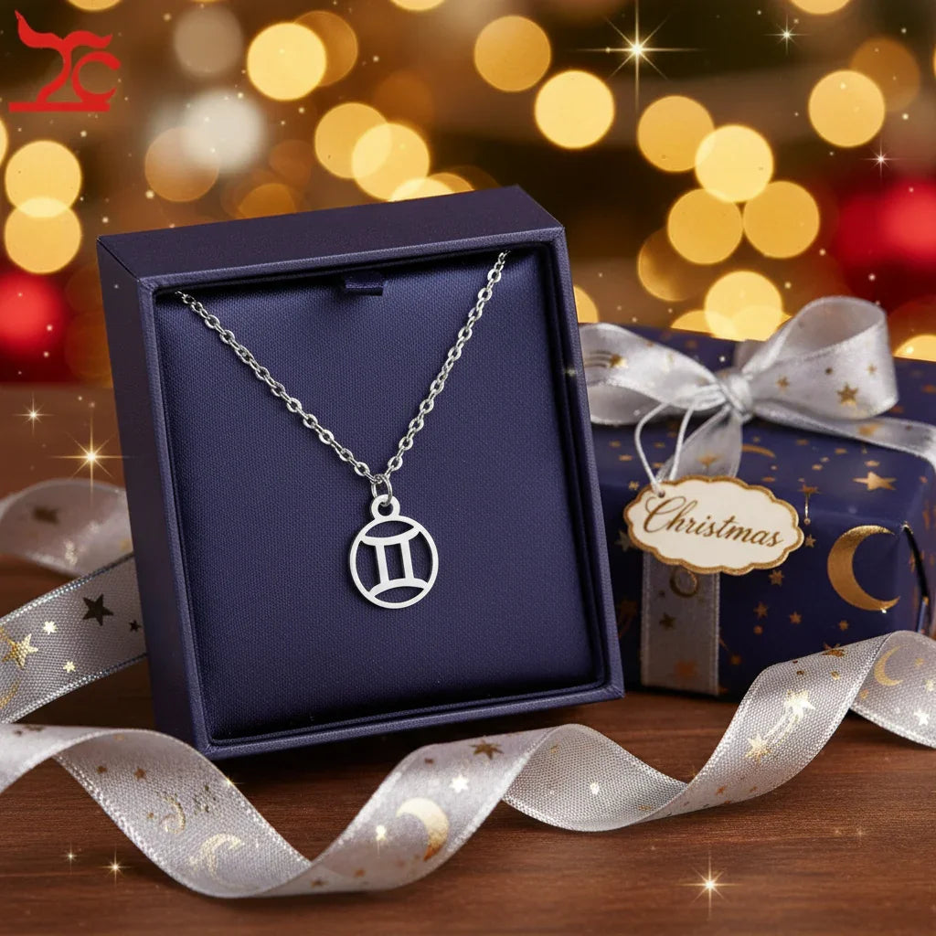 Silver Gemini astrology necklace in a dark blue gift box with festive Christmas wrapping and ribbon
