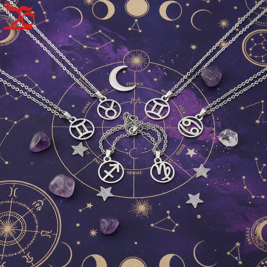 Silver zodiac symbol necklaces on purple star chart background with amethyst stones and glittery stars