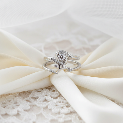 Elegant bridal ring set with diamonds on ivory silk and lace backdrop