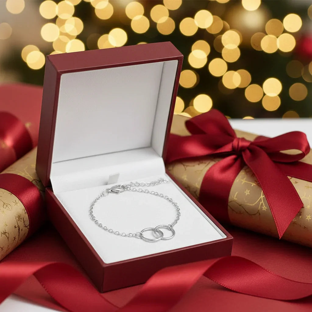 Silver circle link bracelet in elegant red gift box with festive gold and red ribbon wrapping