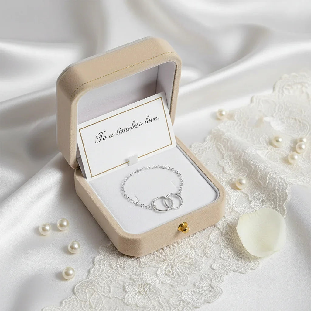 Silver circle bracelet in beige wedding gift box with message To a timeless love on white lace and satin background