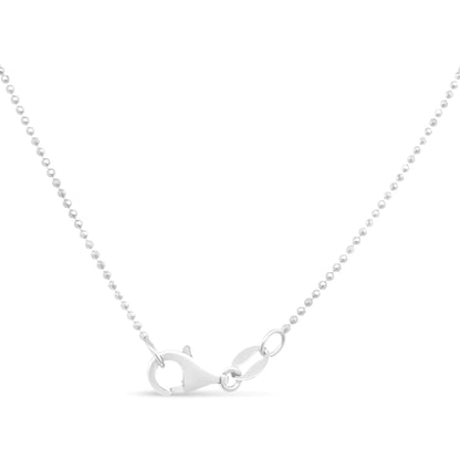 Close-up of delicate silver ball chain necklace with lobster clasp on white background