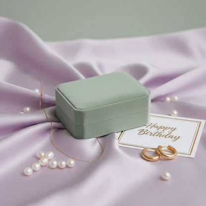 Gold huggie earrings in elegant green velvet gift box on lavender satin with pearls and Happy Birthday card