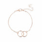 Elegant rose gold bracelet with two interlocking circles on delicate chain, adjustable clasp