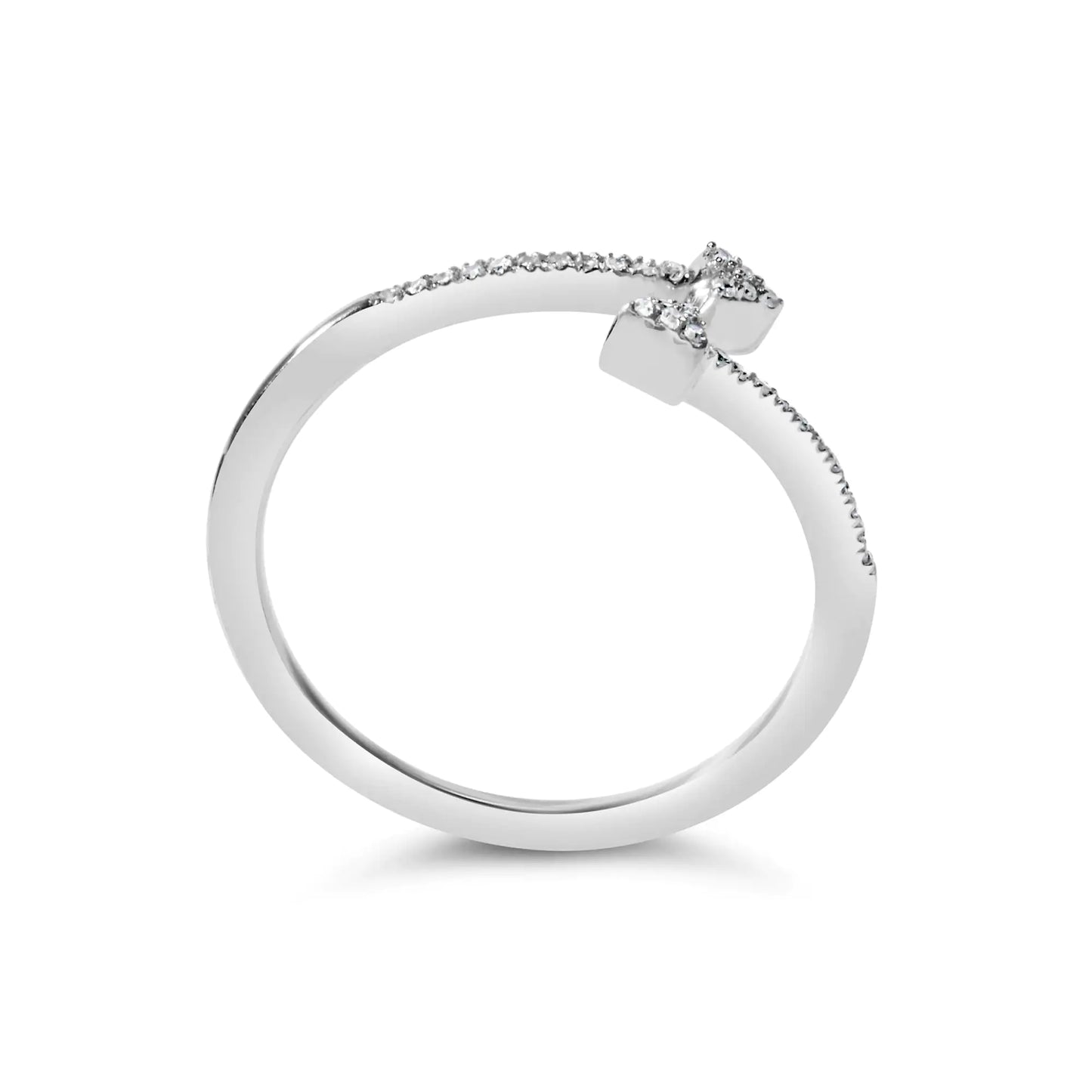 Delicate silver open ring with small diamonds on ends and along one side, fine bridal jewelry