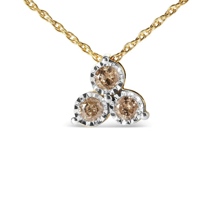 Gold necklace with triad of round champagne gemstones surrounded by silver settings
