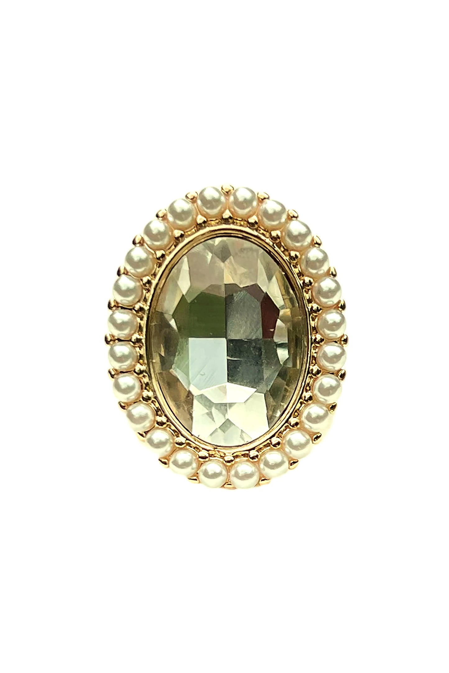 Oval faceted green gemstone ring surrounded by small pearls set in gold jewelry