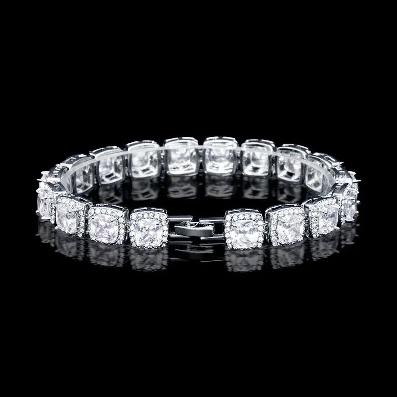 Elegant silver bracelet with square-cut clear gemstones and intricate settings on black background