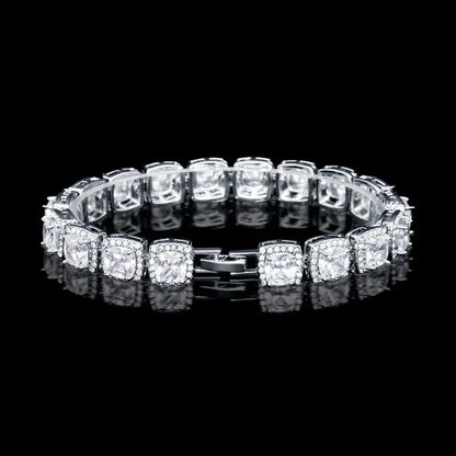 Elegant silver bracelet with square-cut clear gemstones and intricate settings on black background